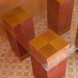 Modern coffee table in burgundy zellige with a tempered glass top.