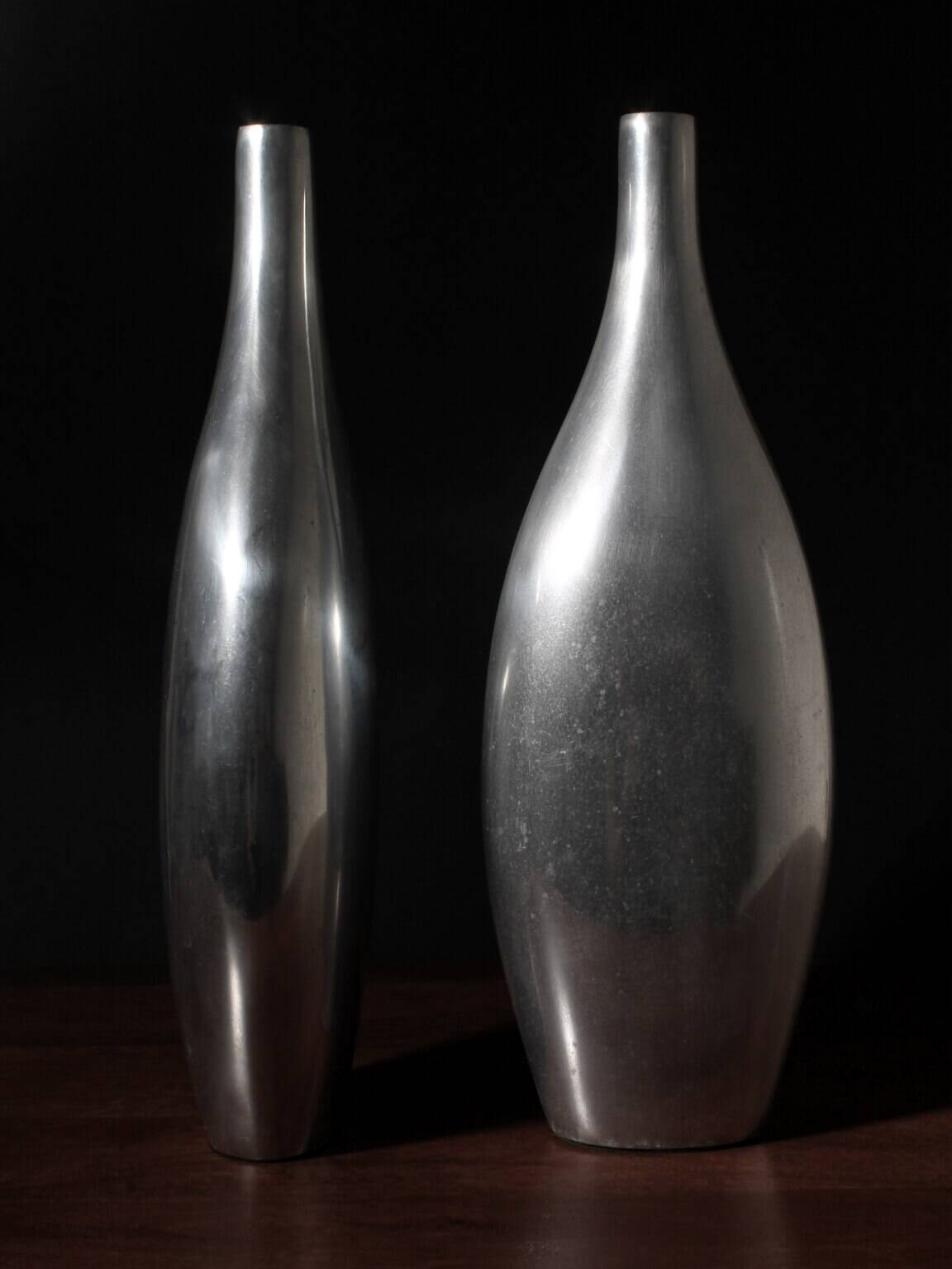 Pair Of Polished Aluminum Tall Vases