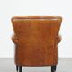 Cognac-colored sheep leather armchair finished with decorative nails