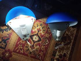 a pair of Ikea Kvintett wall lamps