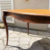 Solid wood table with curved legs