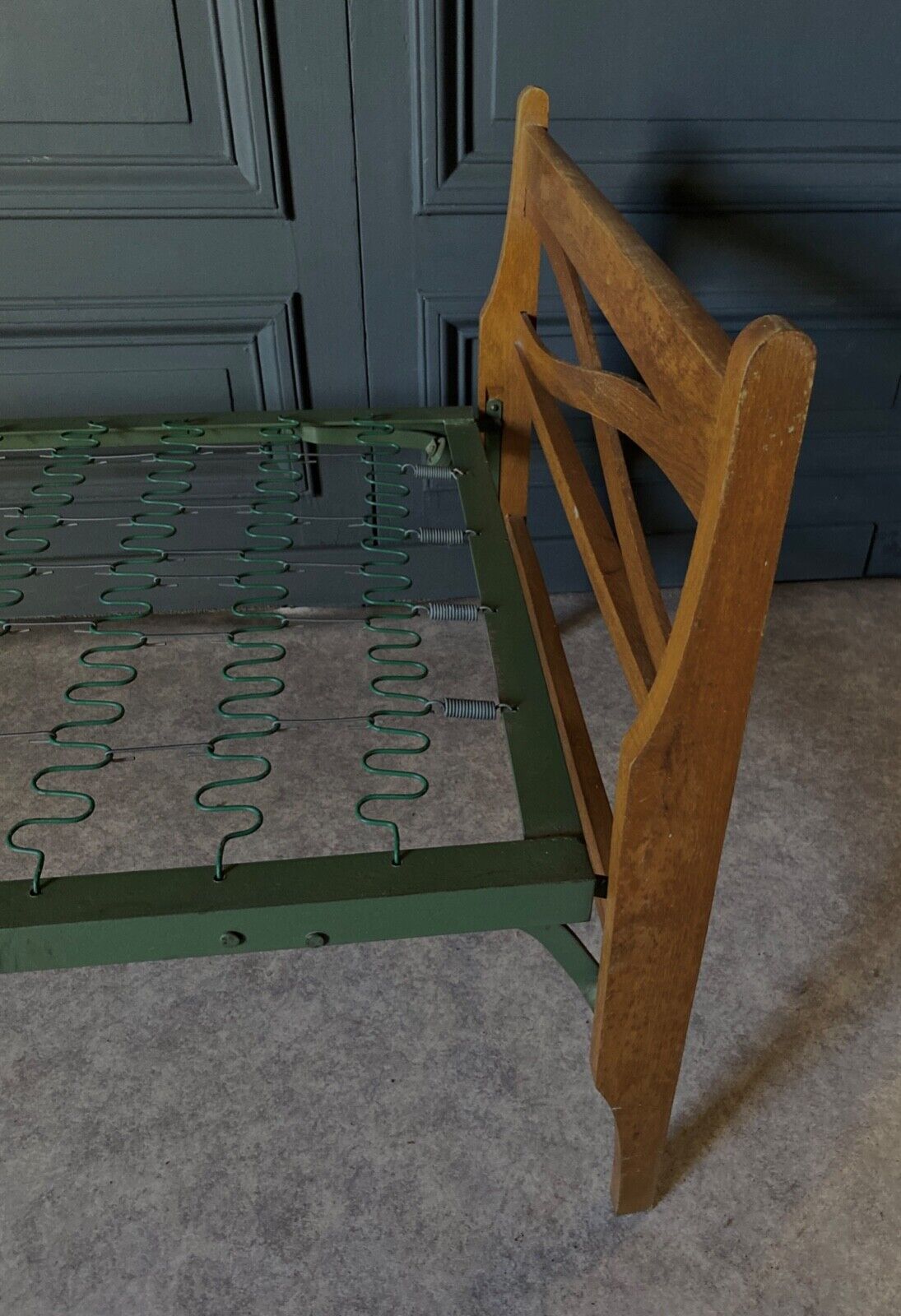 Bed with green metal braces 1960 a person foldable