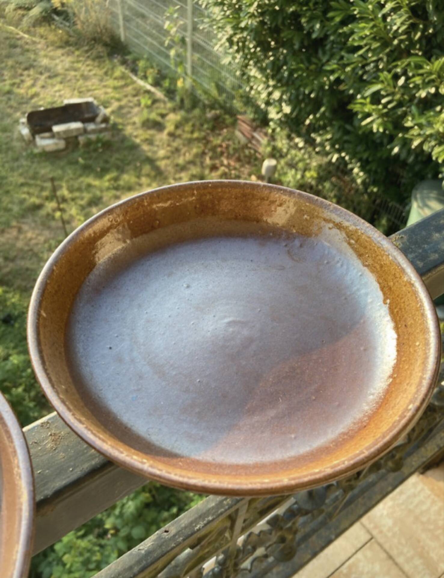 Deep plates made of organic, wild, earthy marsh clay.