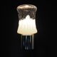 Transparent and white glass torch-type wall light.