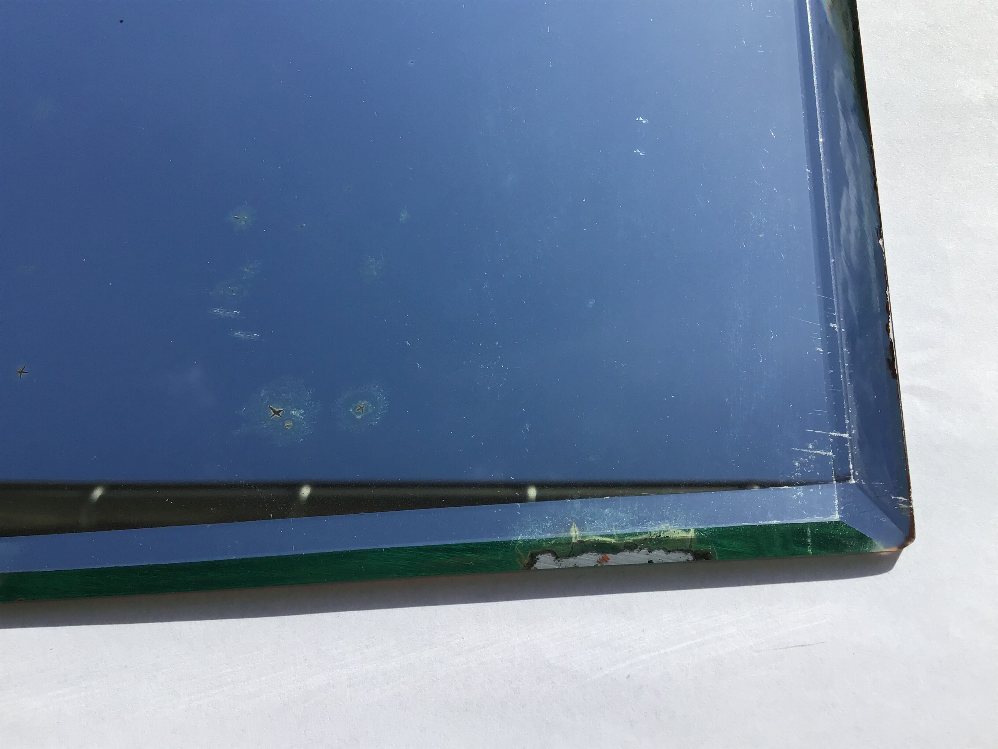 Bevelled mirror trapeze two waves at the top