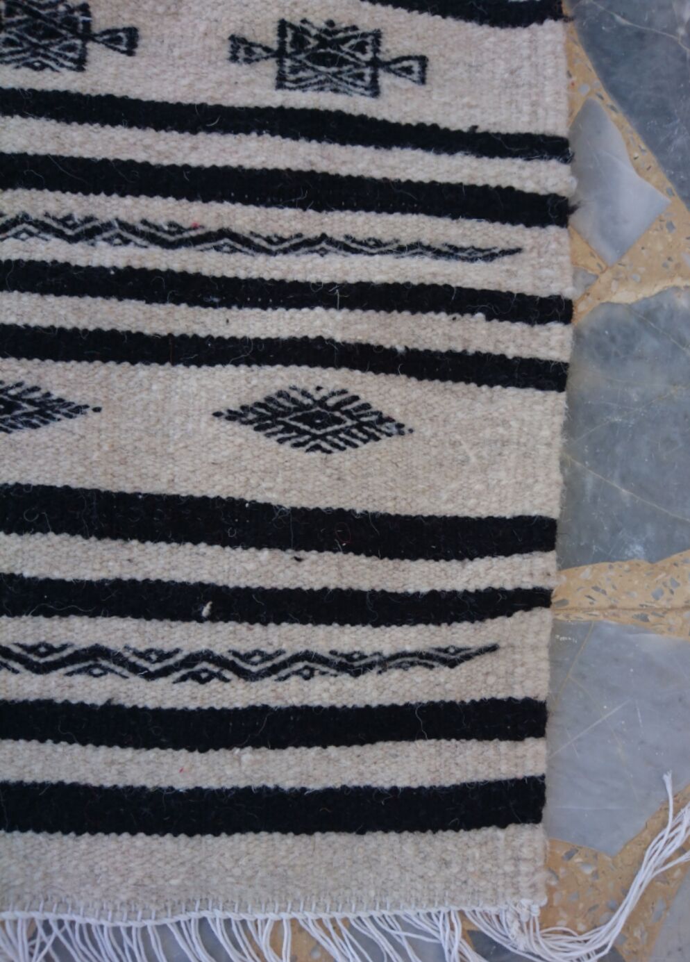 Beige and black handmade carpet, 110x55cm