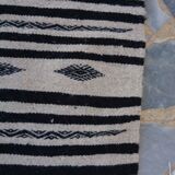 Beige and black handmade carpet, 110x55cm
