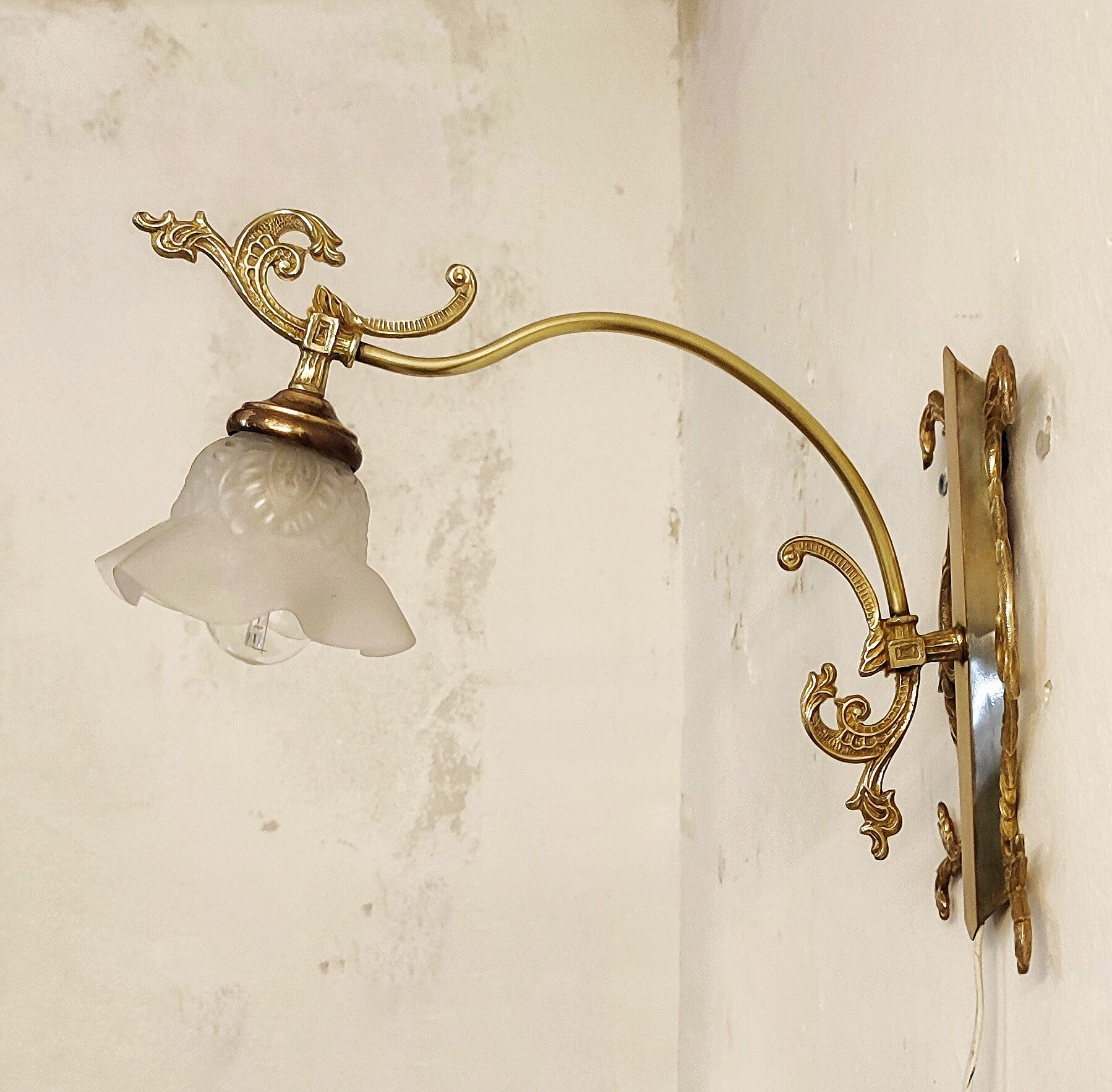 Bronze Modernist wall lamp. Spain, 1930s.