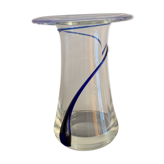 Transparent glass vase and blue swirls
