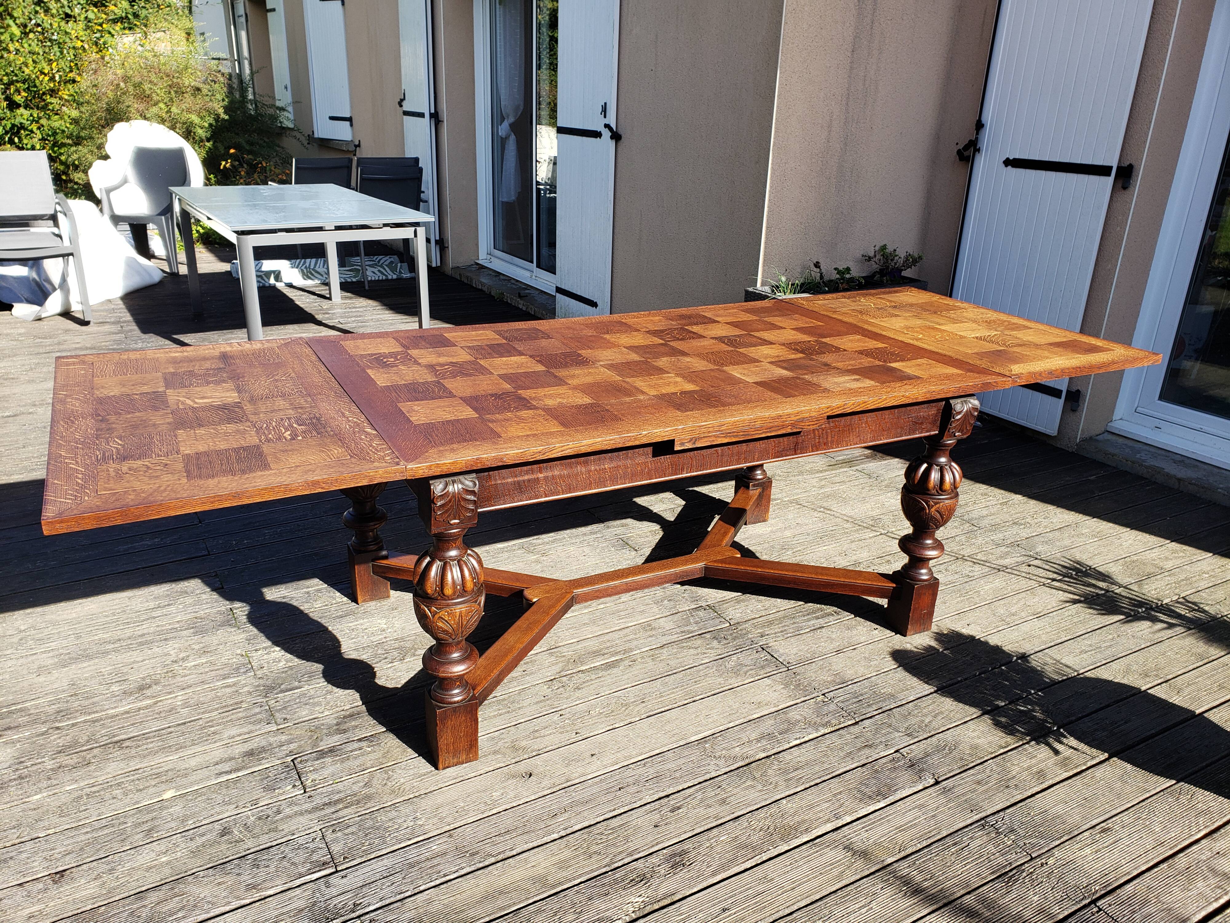 1910s Jacobean style solid oak extending drawer dining table