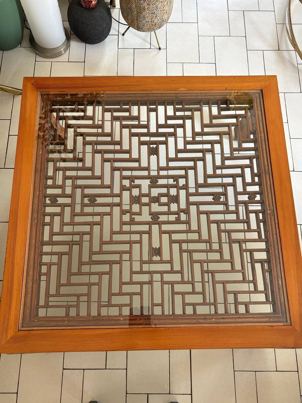 Large Chinese/Asian coffee table in wood – latticework decoration under varnish.