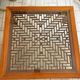 Large Chinese/Asian coffee table in wood – latticework decoration under varnish.
