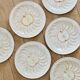 Vintage earthenware plates with a trompe l'oeil apple tart design