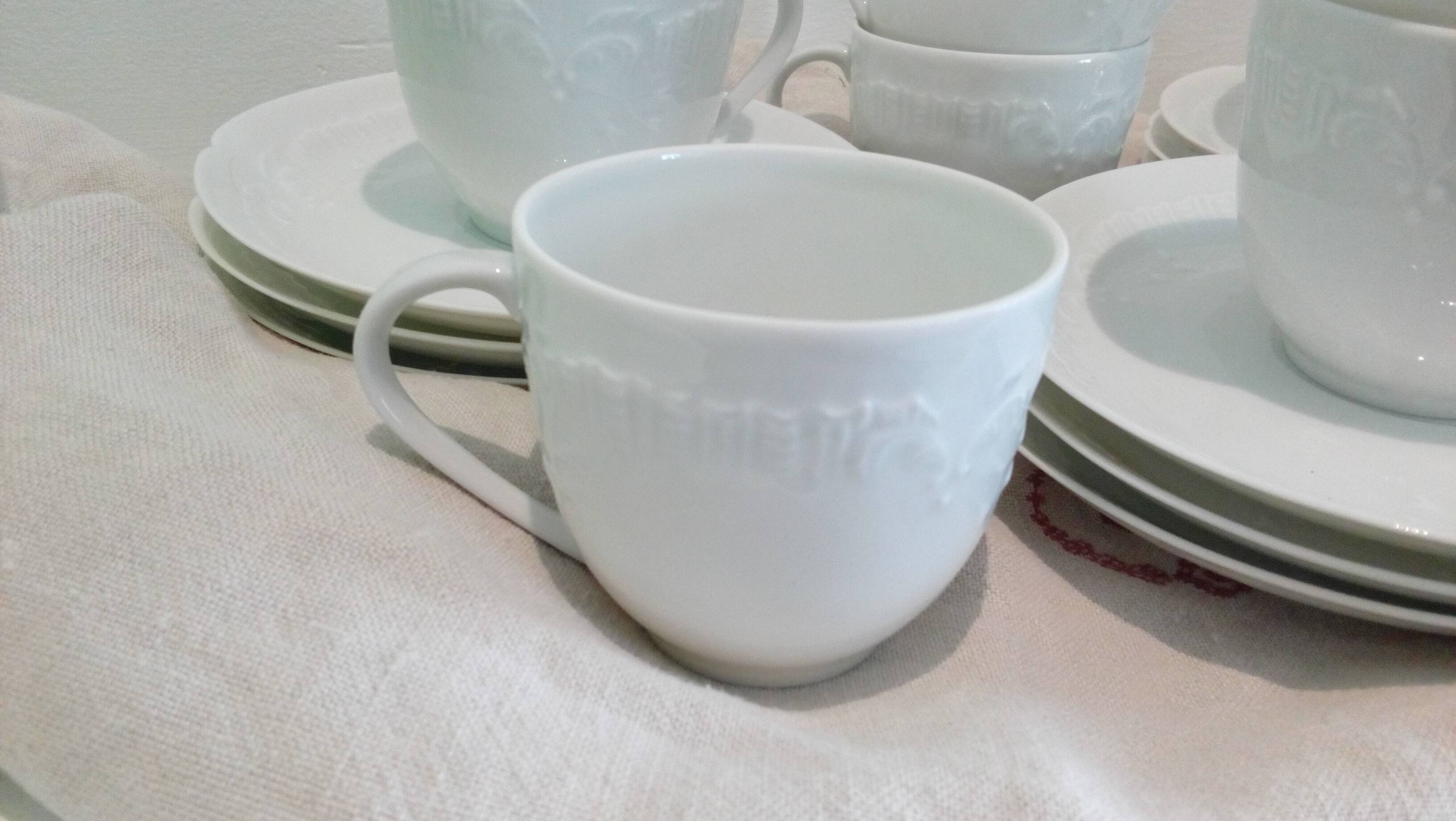 Set of 9 white porcelain coffee cups
