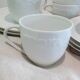 Set of 9 white porcelain coffee cups