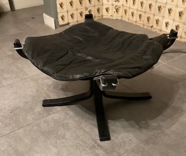 Leather Falcon armchair and footrest
