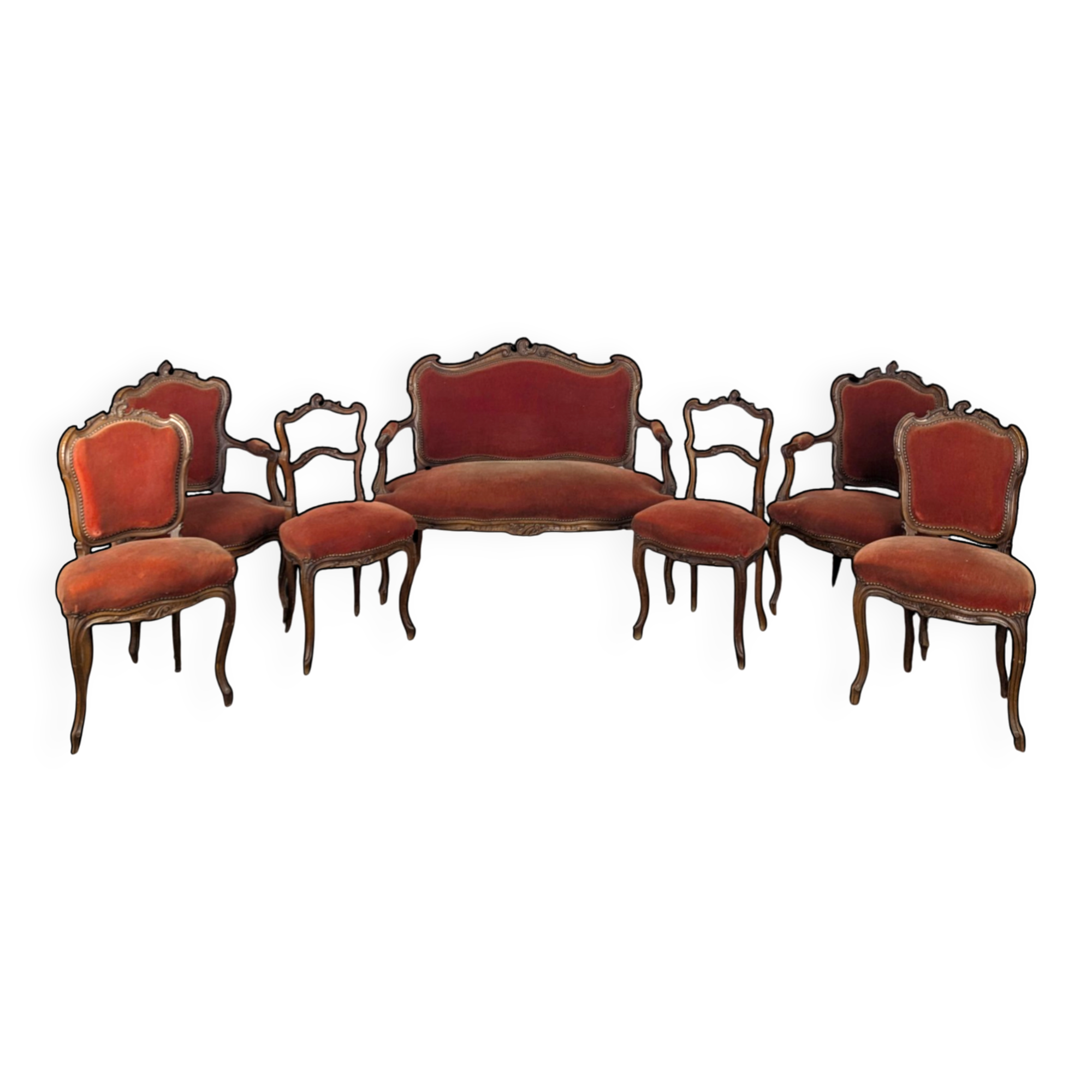 Louis XV style salon in carved walnut with orange velvet, seven pieces.
