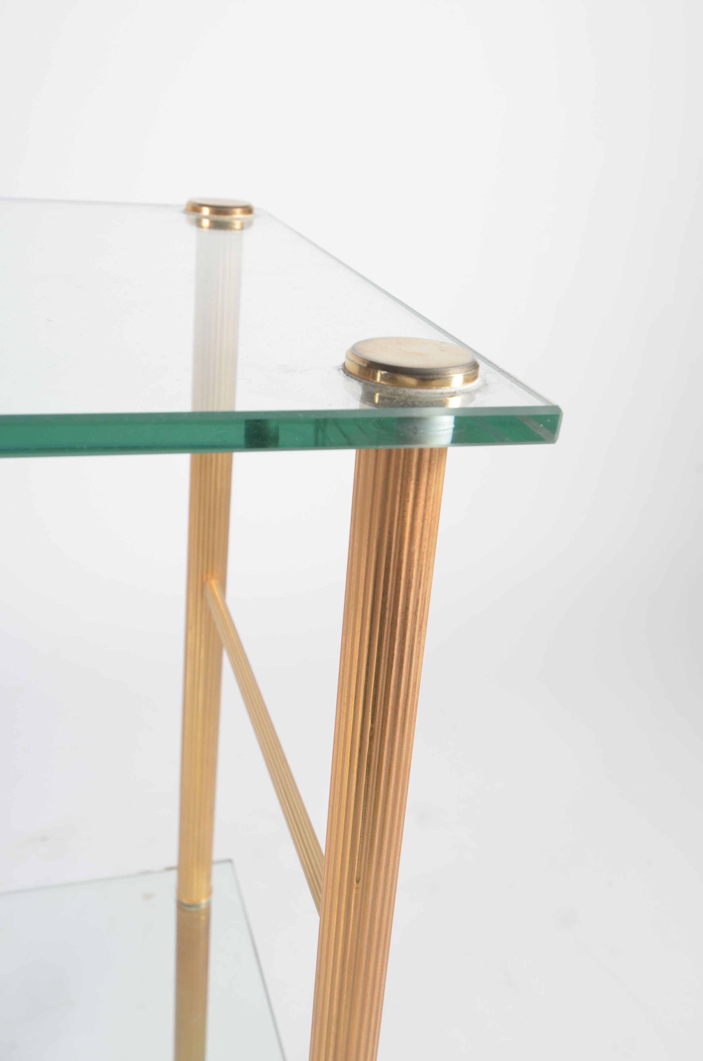 Glass and golden brass side table