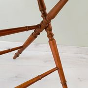 Vintage folding table with turned legs.