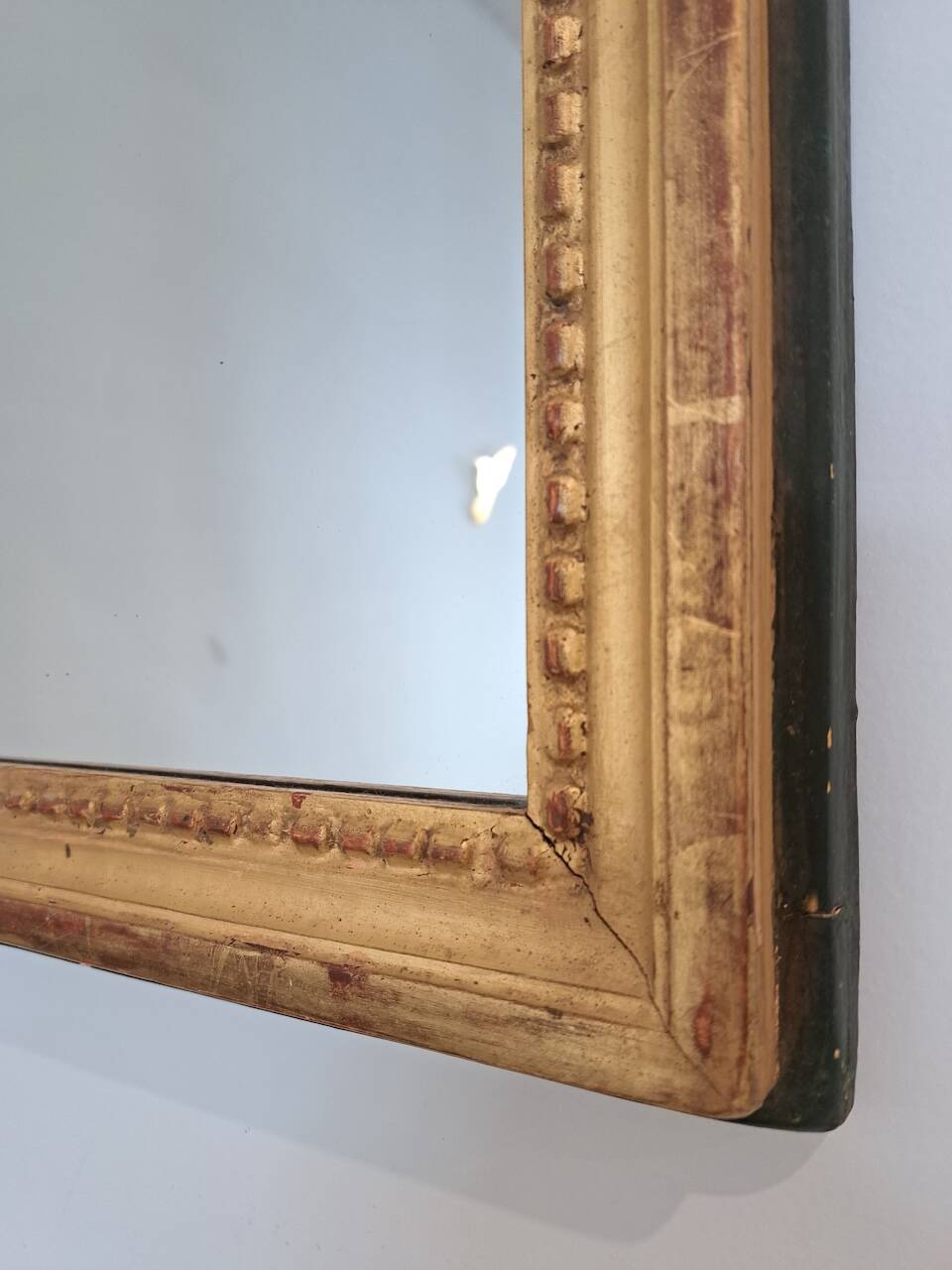 Antique mirror in wood and gilded stucco