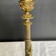 Pair of 19th-century gilded bronze candlesticks in Empire style.