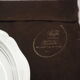 Round plate, Chinon collection with gold trim, Christofle, and its protective felt pouch.