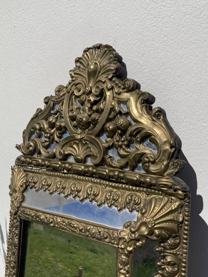Golden mirror with 19th century embossed brass beads