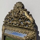 Golden mirror with 19th century embossed brass beads