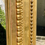 Gilded plaster mirror Louis XVl style