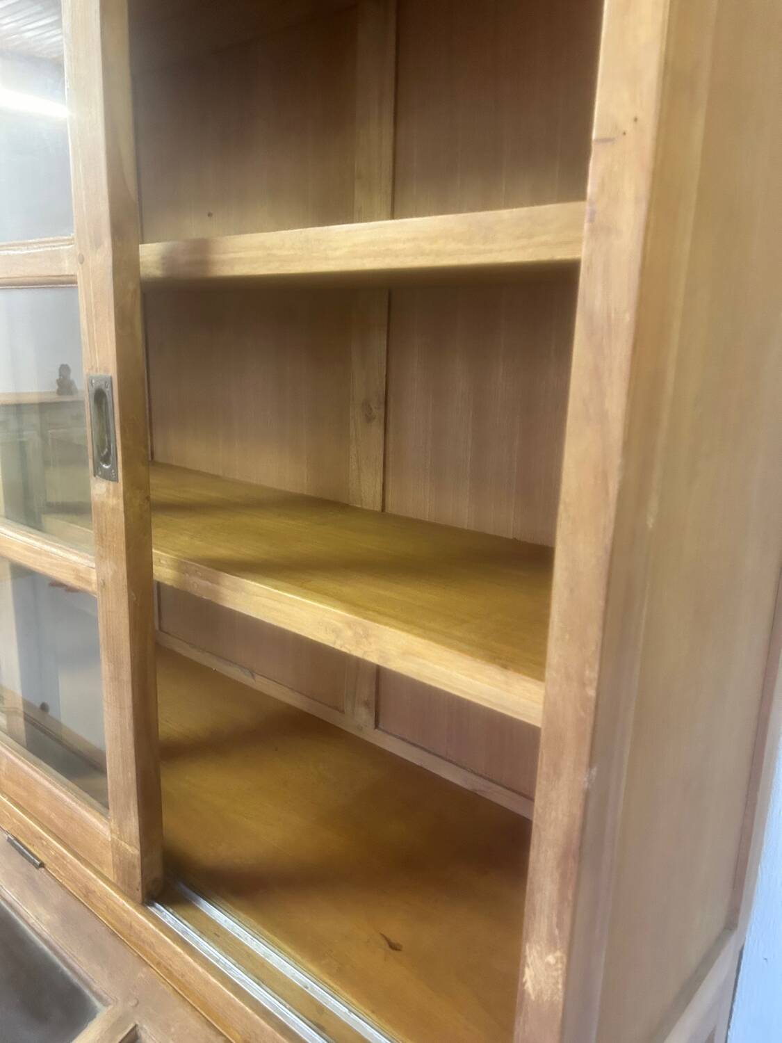 Large antique haberdashery cabinet with glass doors.