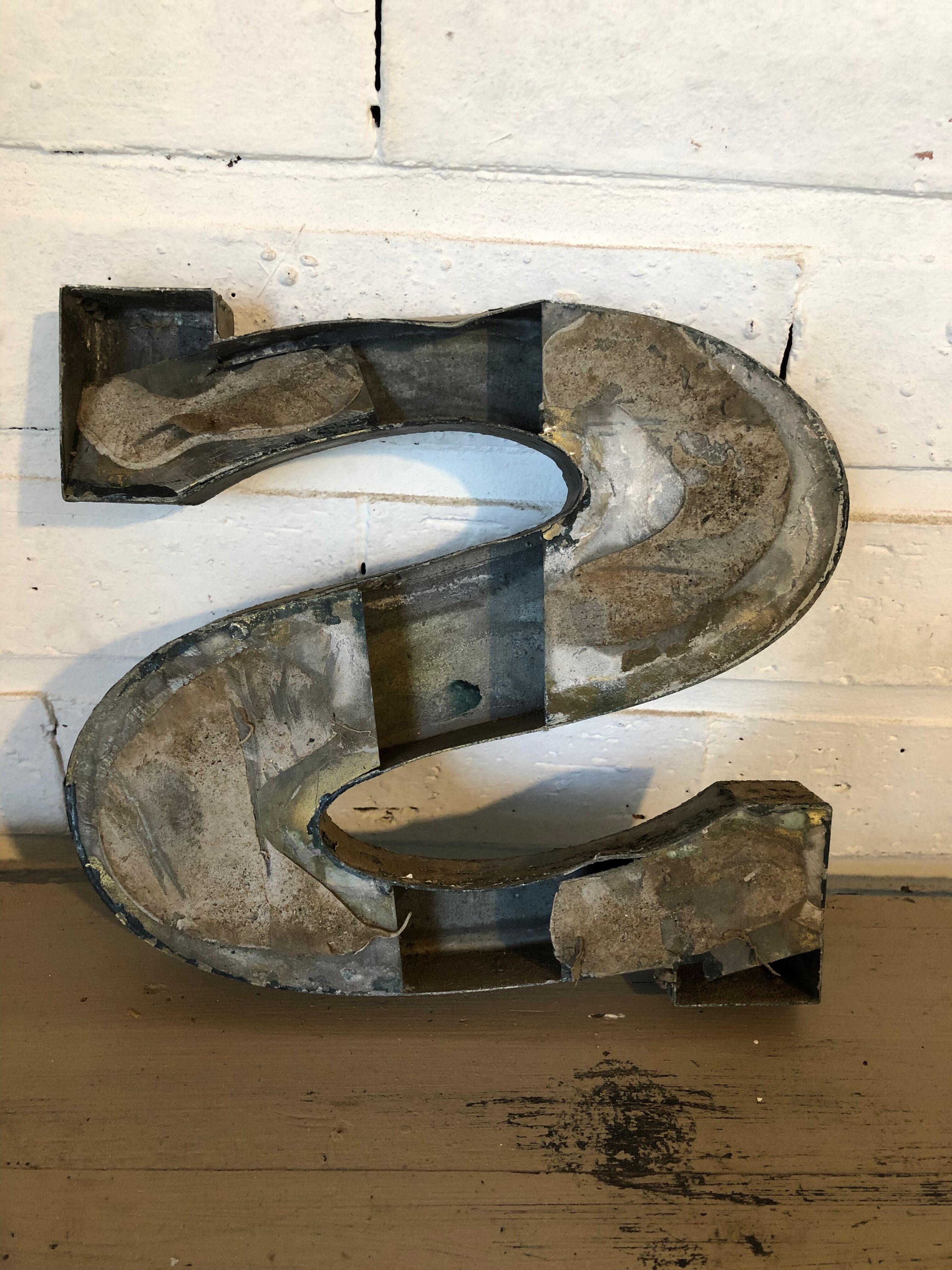 Blue sign letter "S"