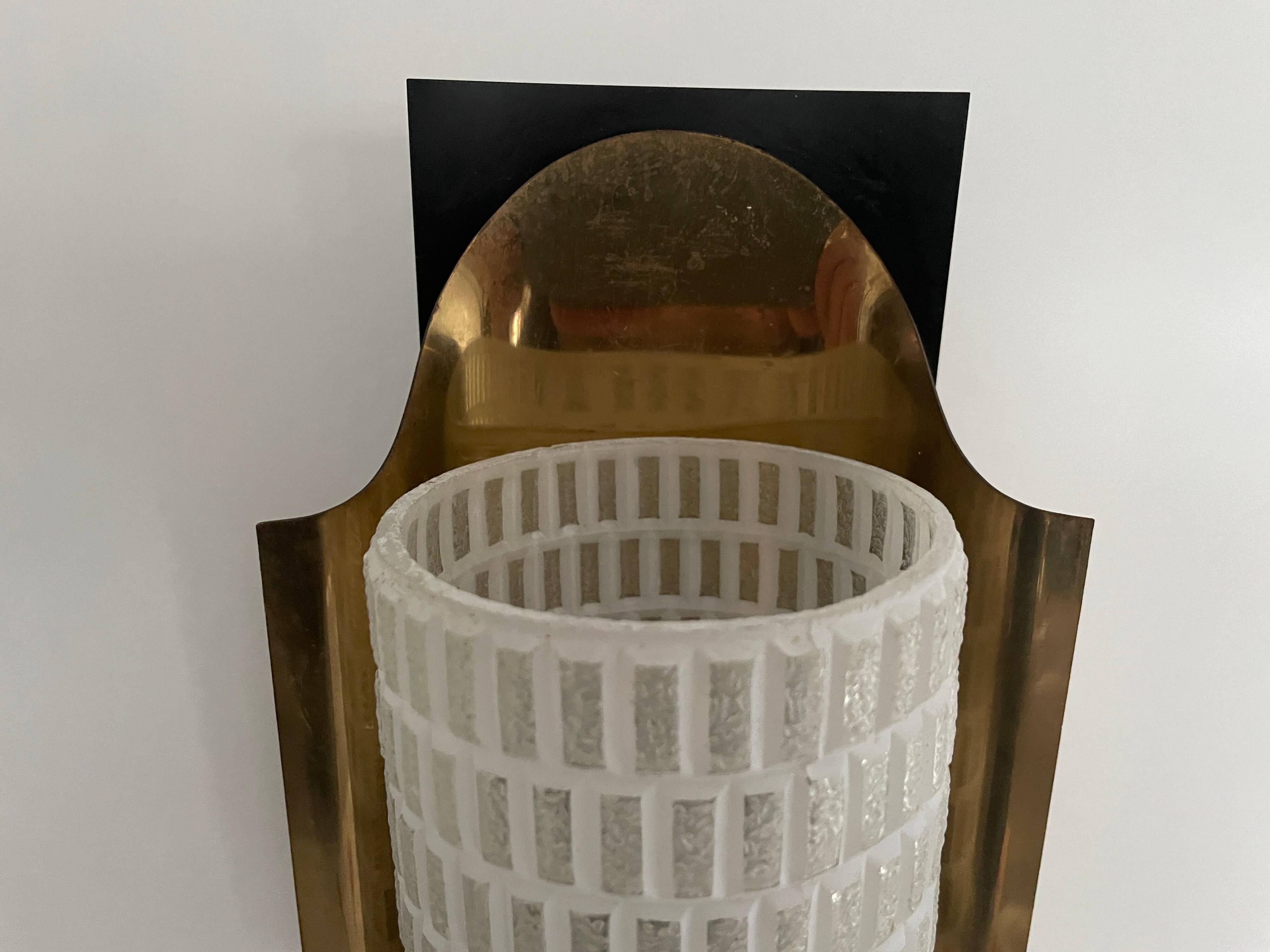 Mid-century pair of wall sconces in textured glass and brass, 1950s, Germany.