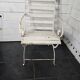 Old wrought iron and wood garden armchair