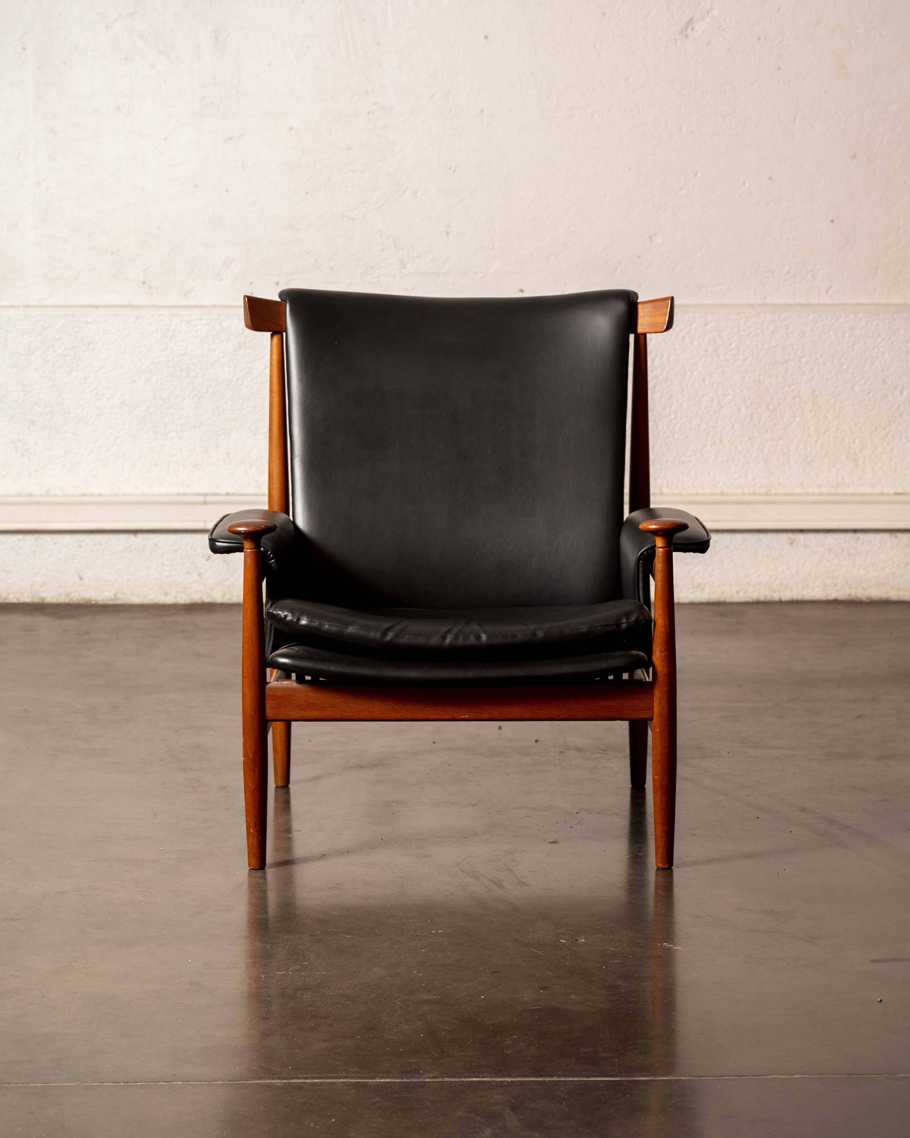 Finished Juhl armchair and its ottoman.