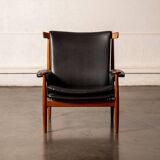 Finished Juhl armchair and its ottoman.