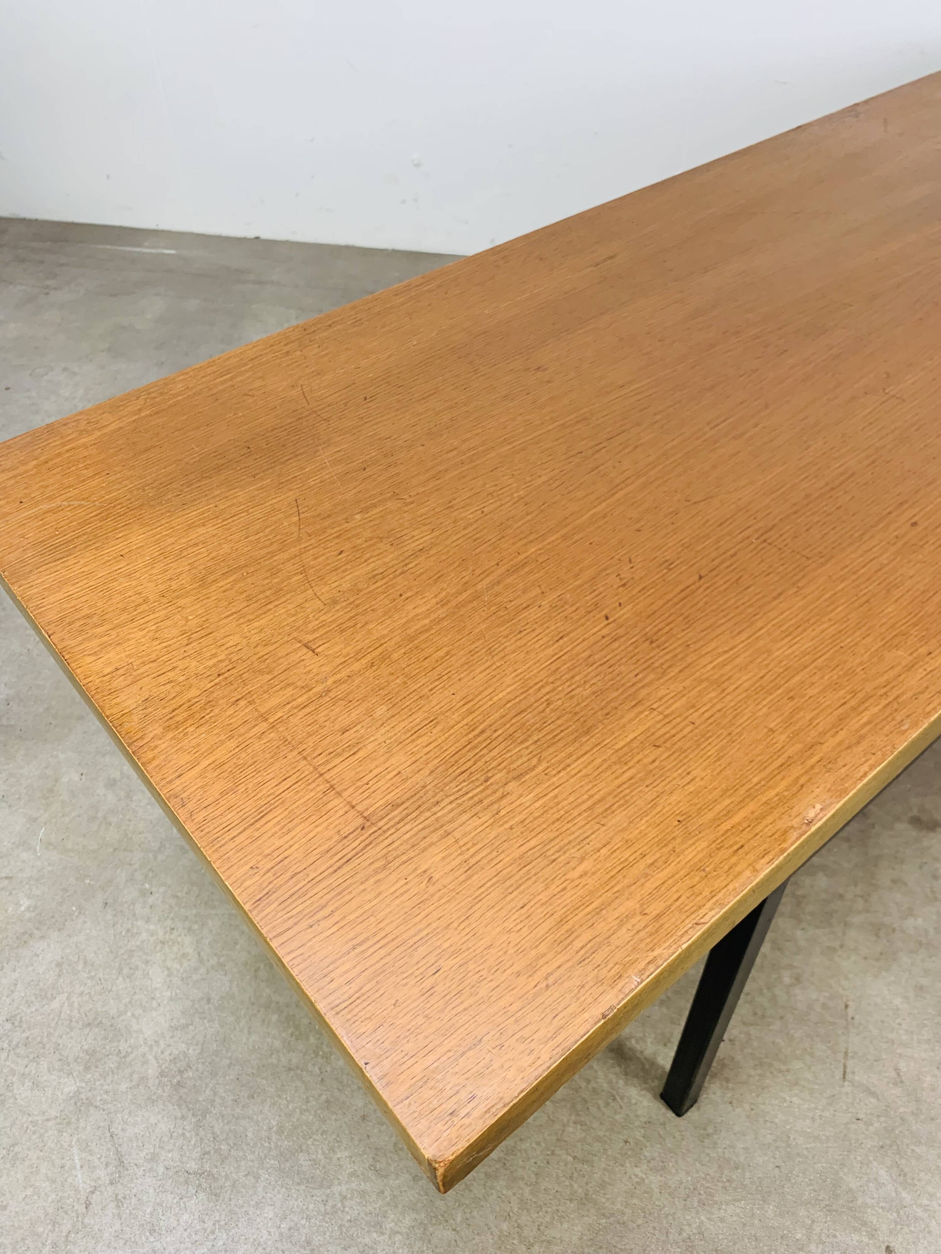1950s modernist coffee table, wood and black metal.
