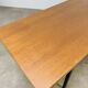 1950s modernist coffee table, wood and black metal.