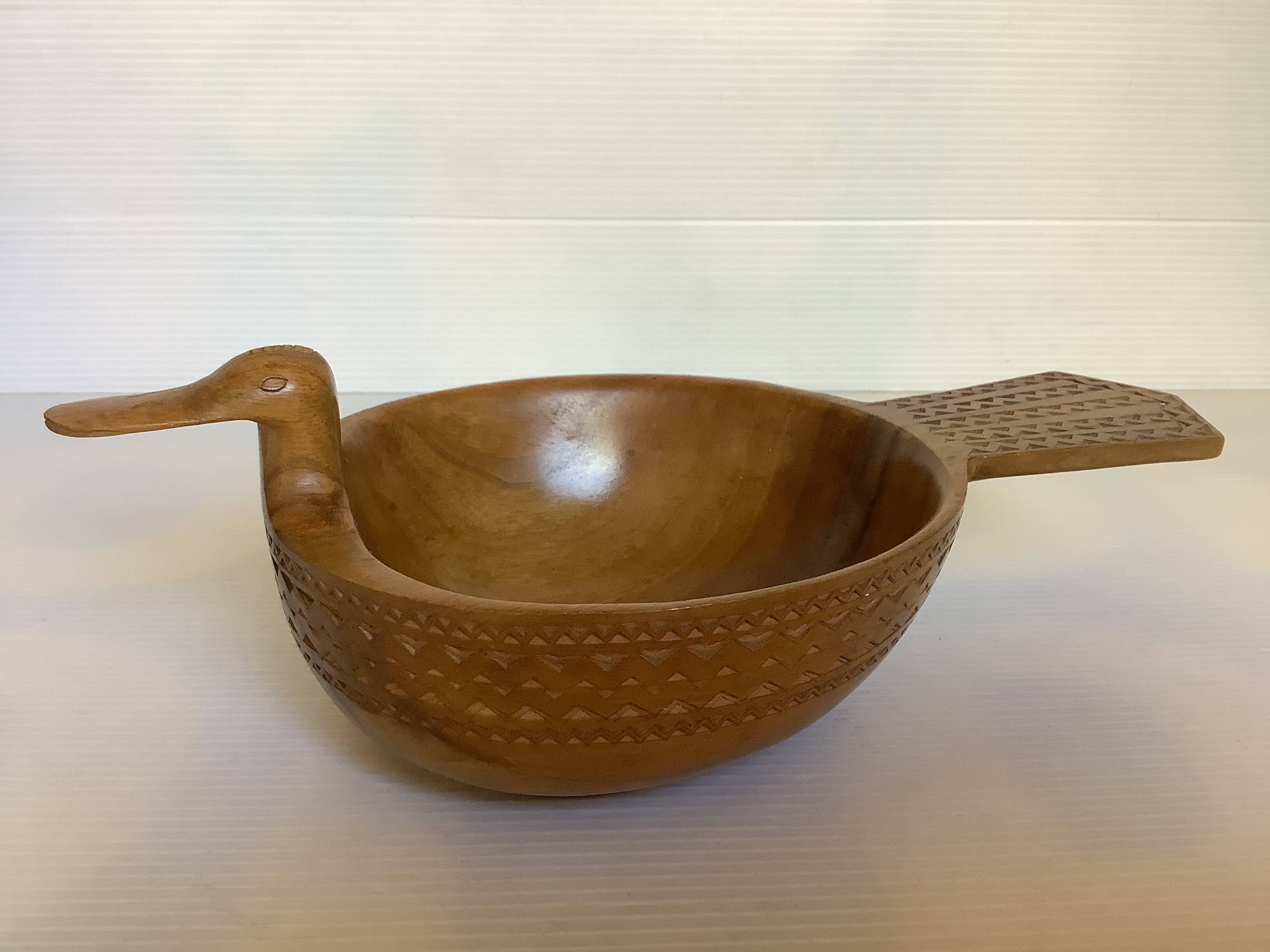 Carved wooden bird pocket