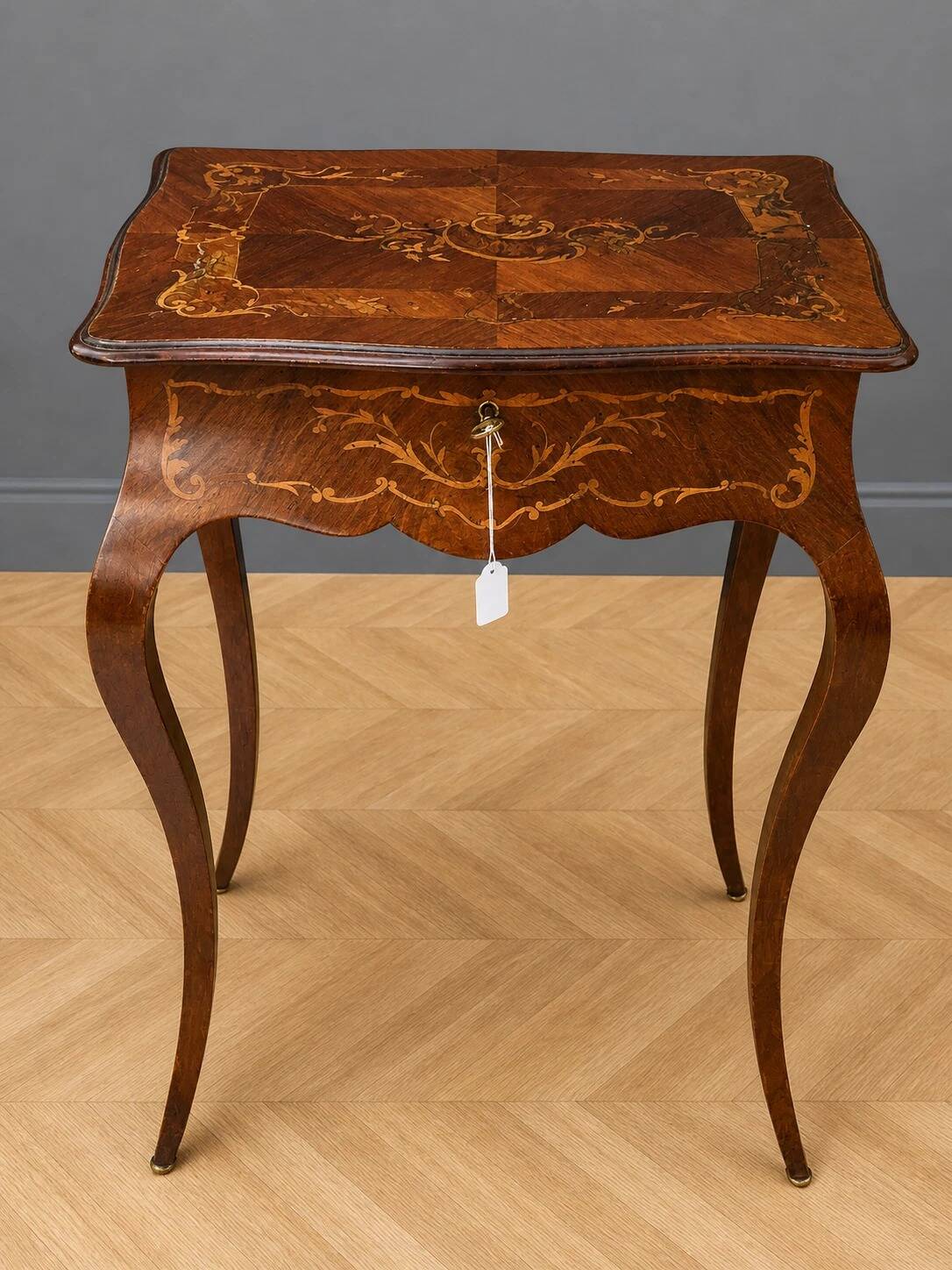 work table from the Napoleonic III era with marquetry of scrolls and patterns