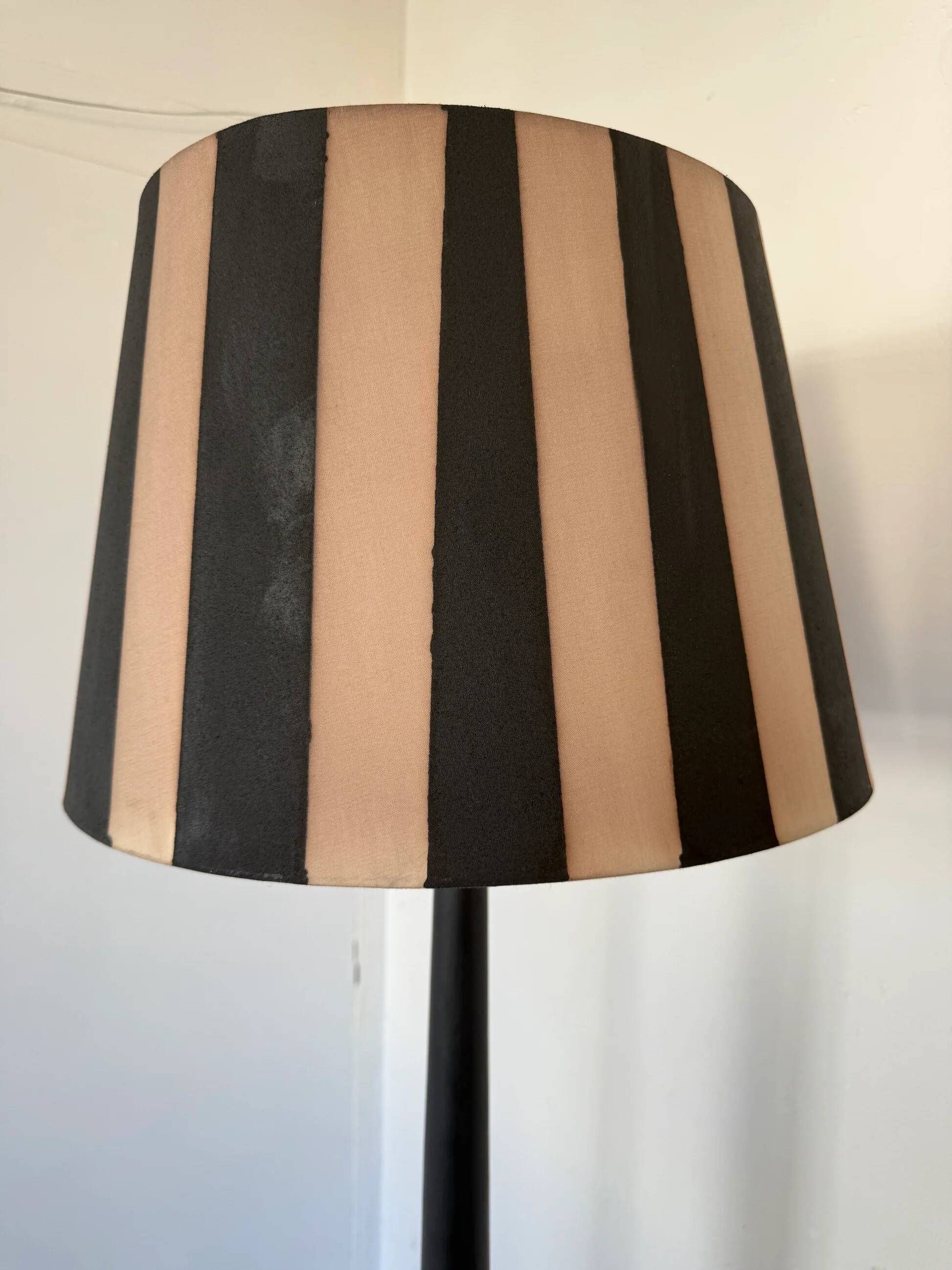 Vintage floor lamp in black patinated wood and striped lampshade