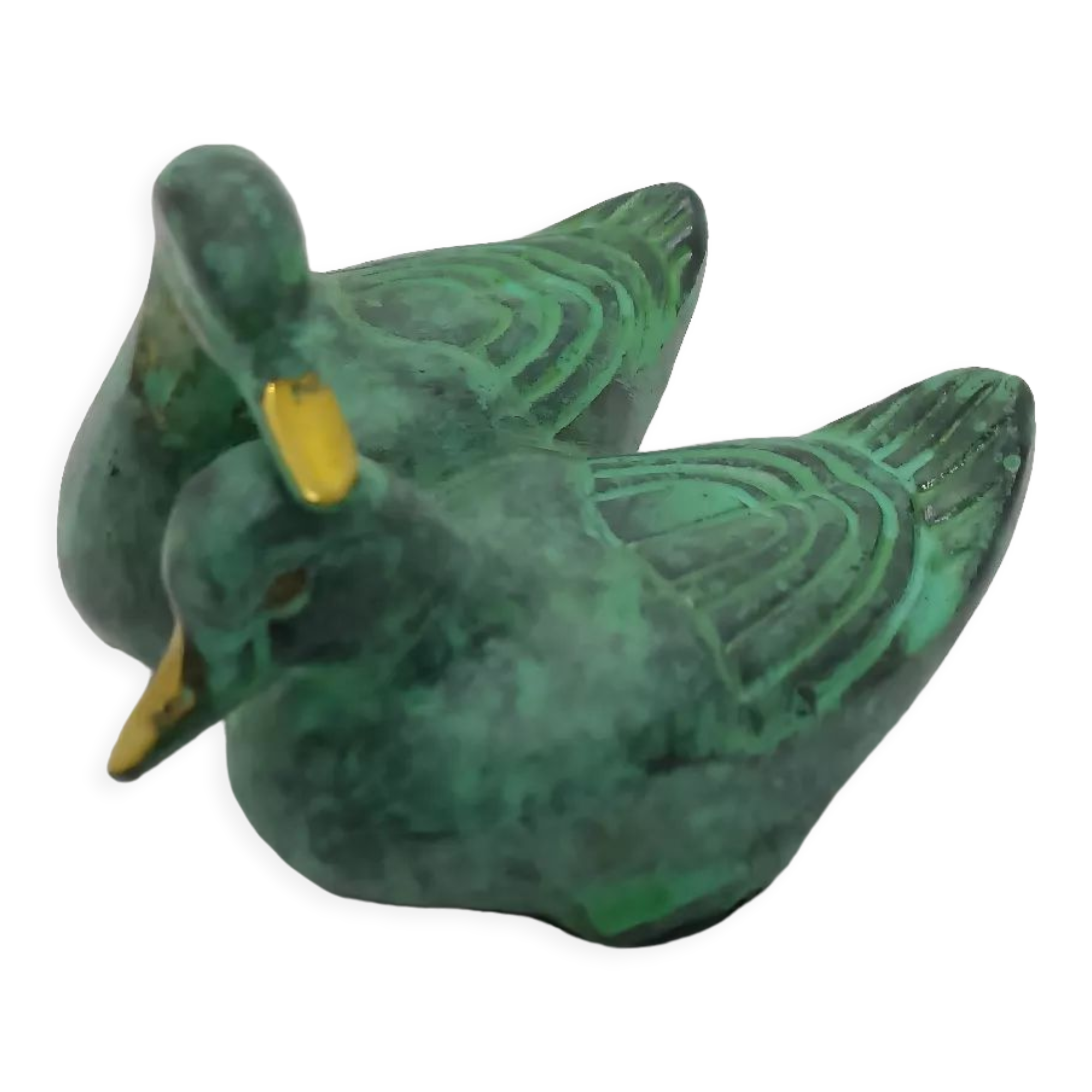 Two green and golden ducks in brass