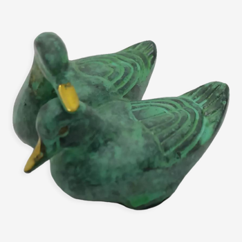 Two green and golden ducks in brass