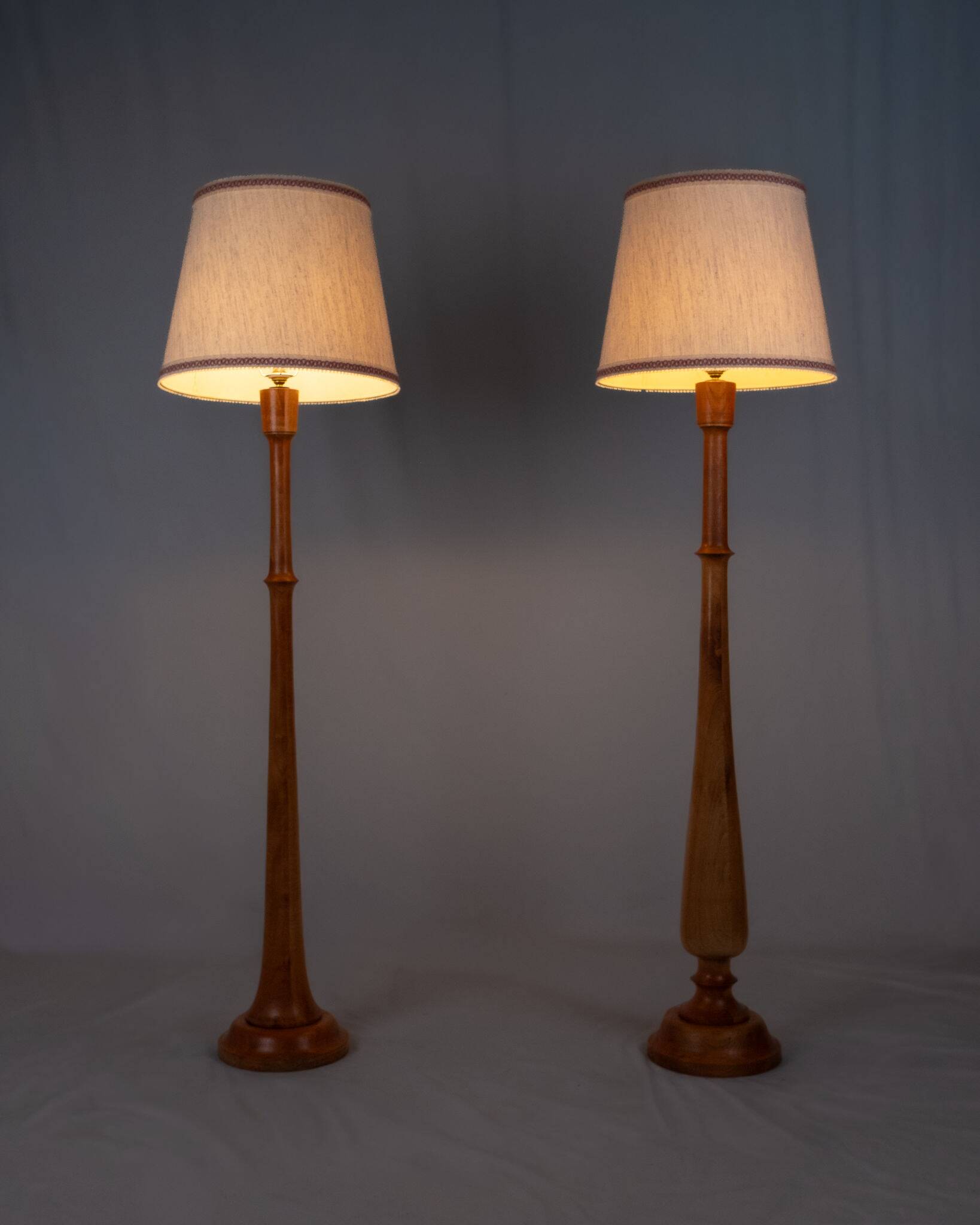 Pair of turned wooden floor lamps in Art Deco style, France, mid-20th century.
