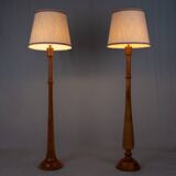 Pair of turned wooden floor lamps in Art Deco style, France, mid-20th century.
