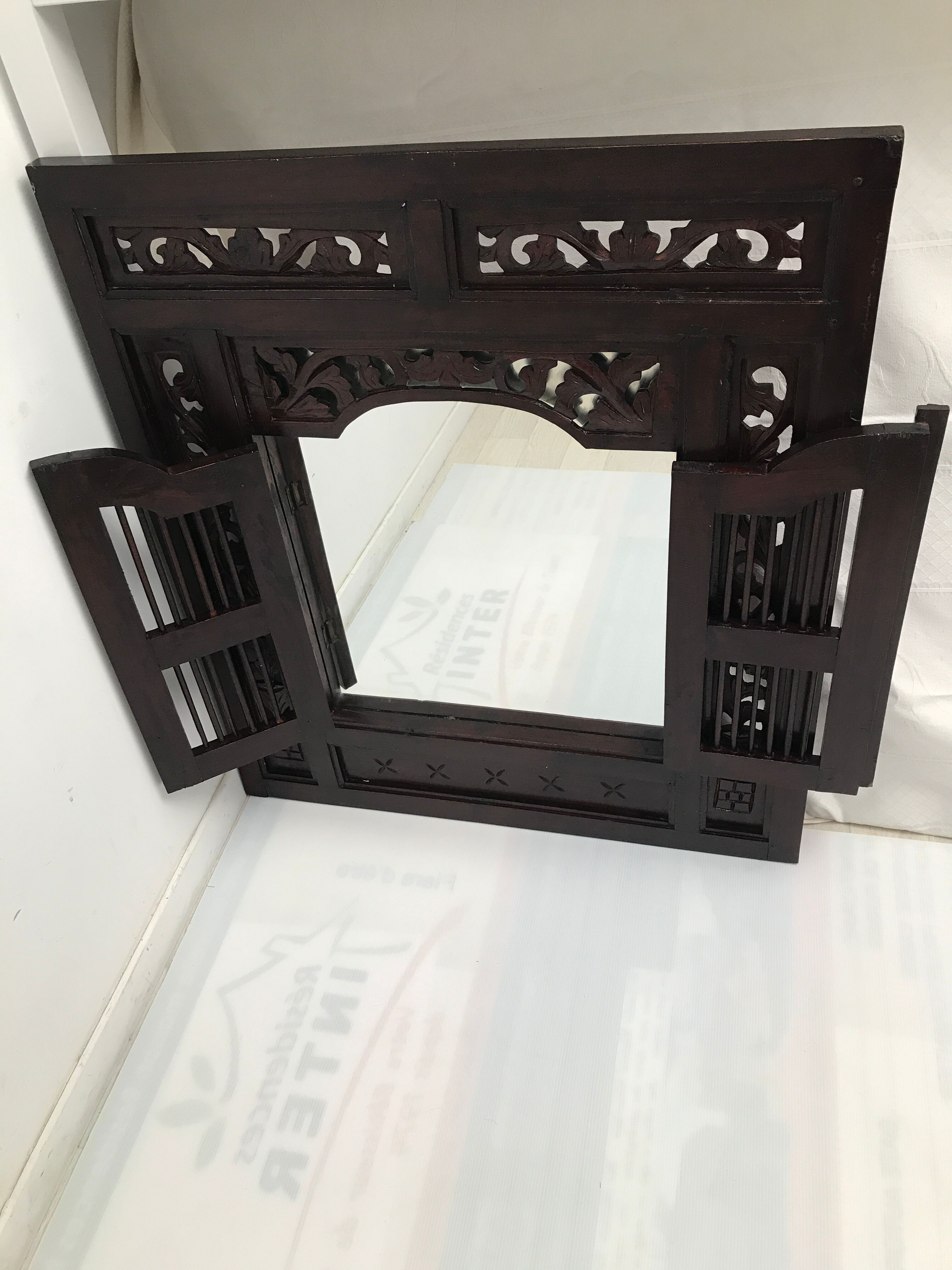 Vintage shuttered Indonesian mirror