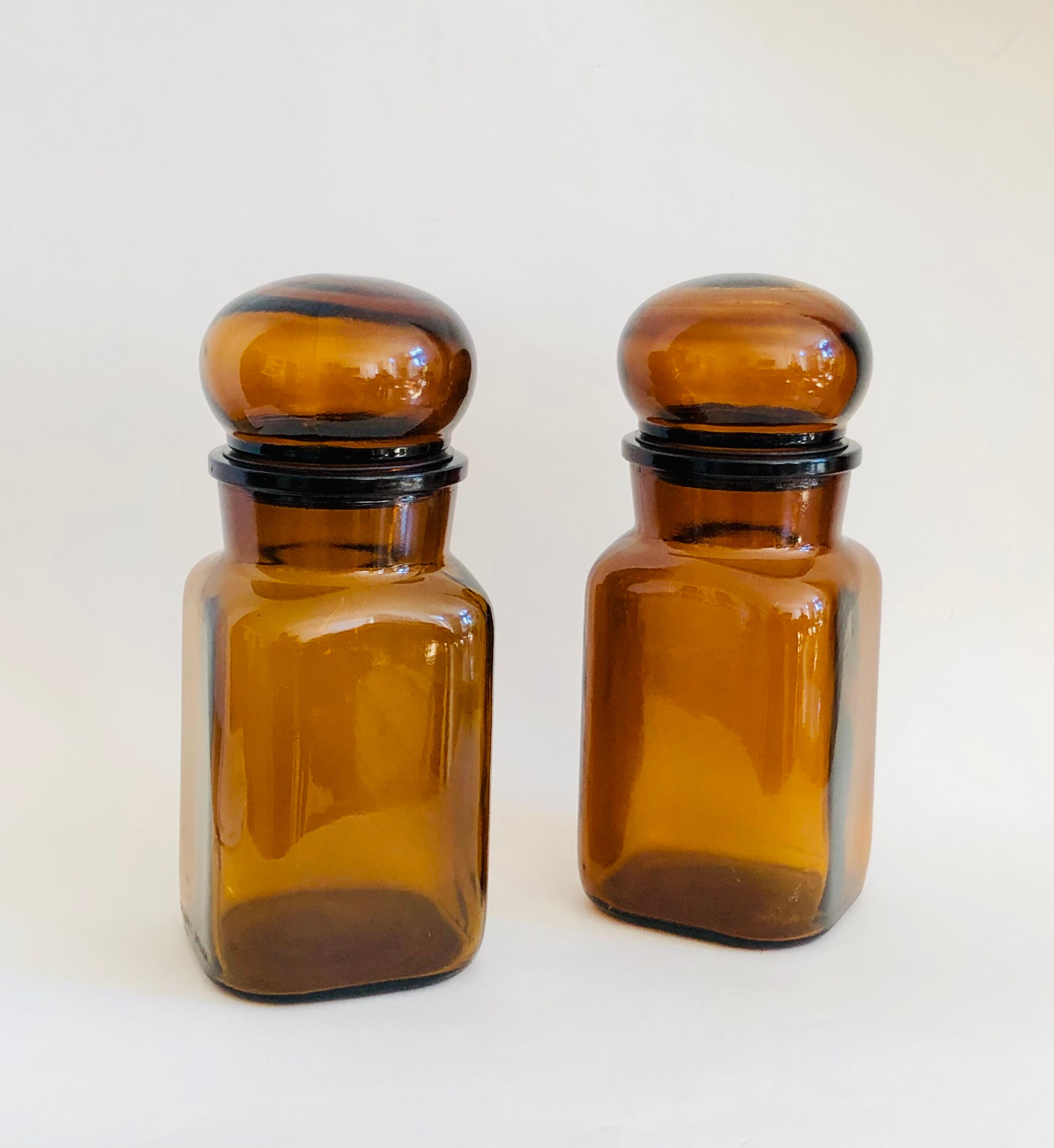 Pair of vintage amber glass jars