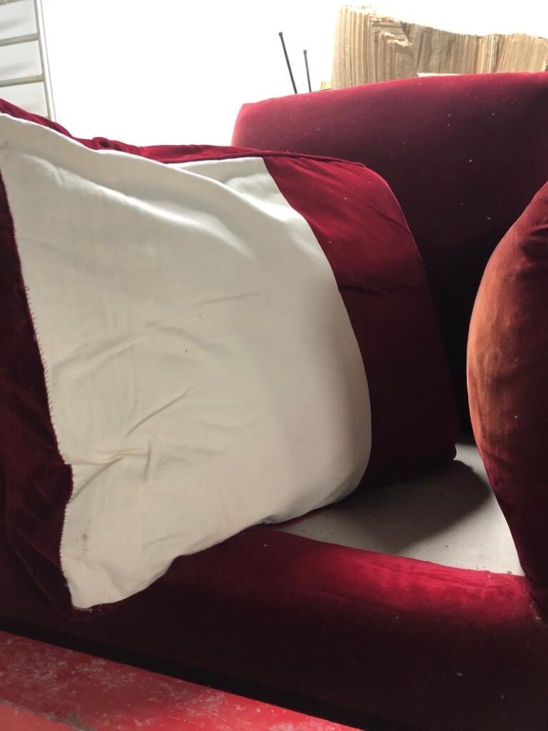 Red armchair with decorated base
