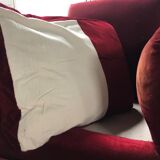 Red armchair with decorated base