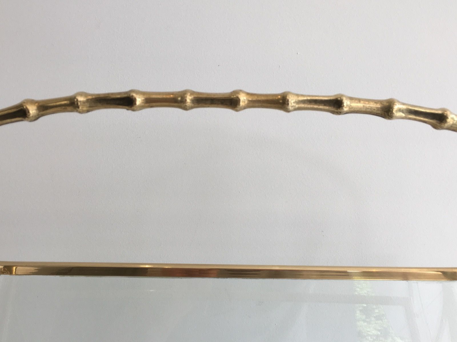 Bamboo-style brass magazine rack from the Baguès house.