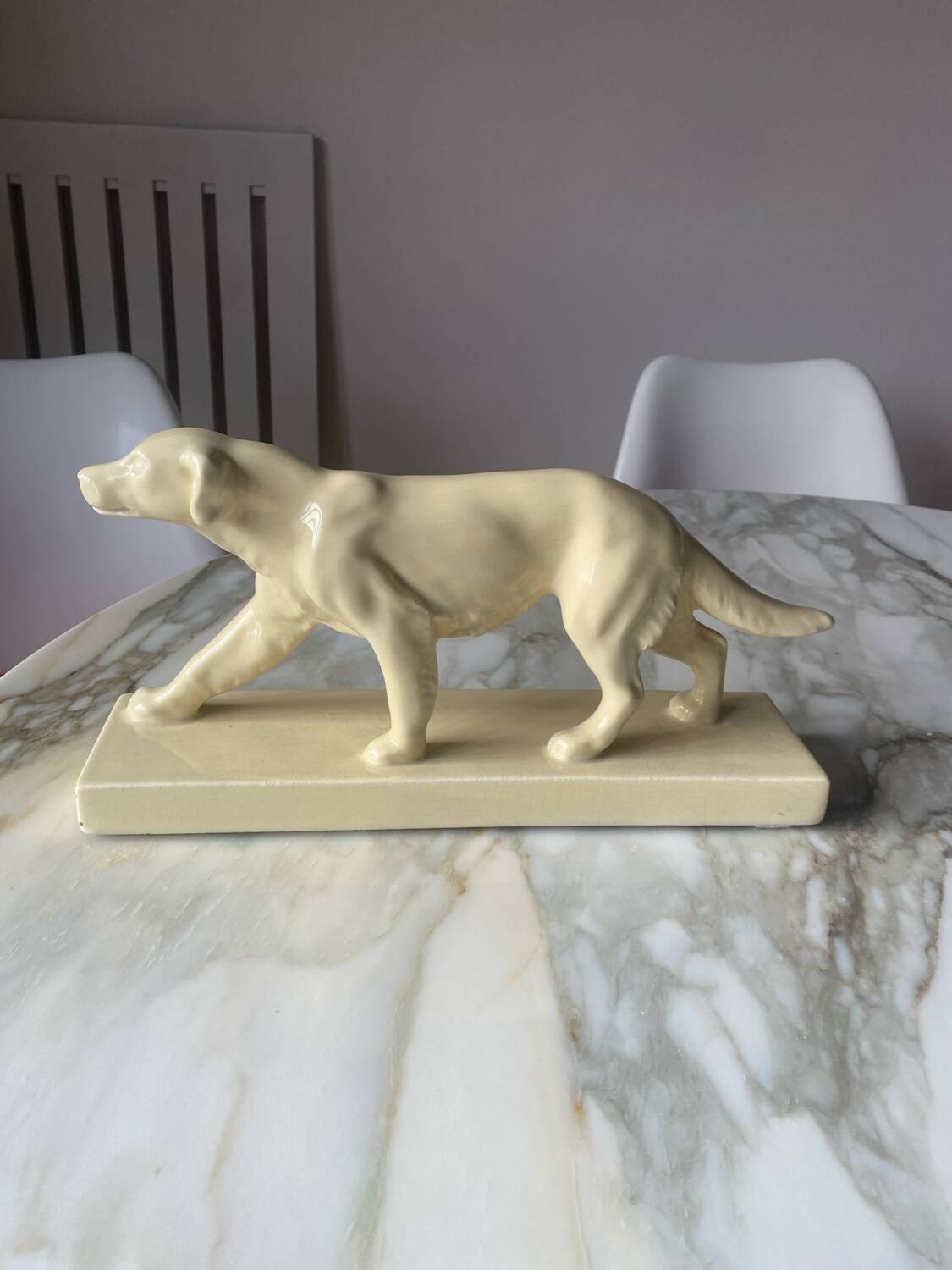 Ceramic of a walking dog brand Odyv